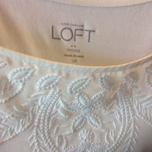 Loft Sleeveless banded hem cream tank.